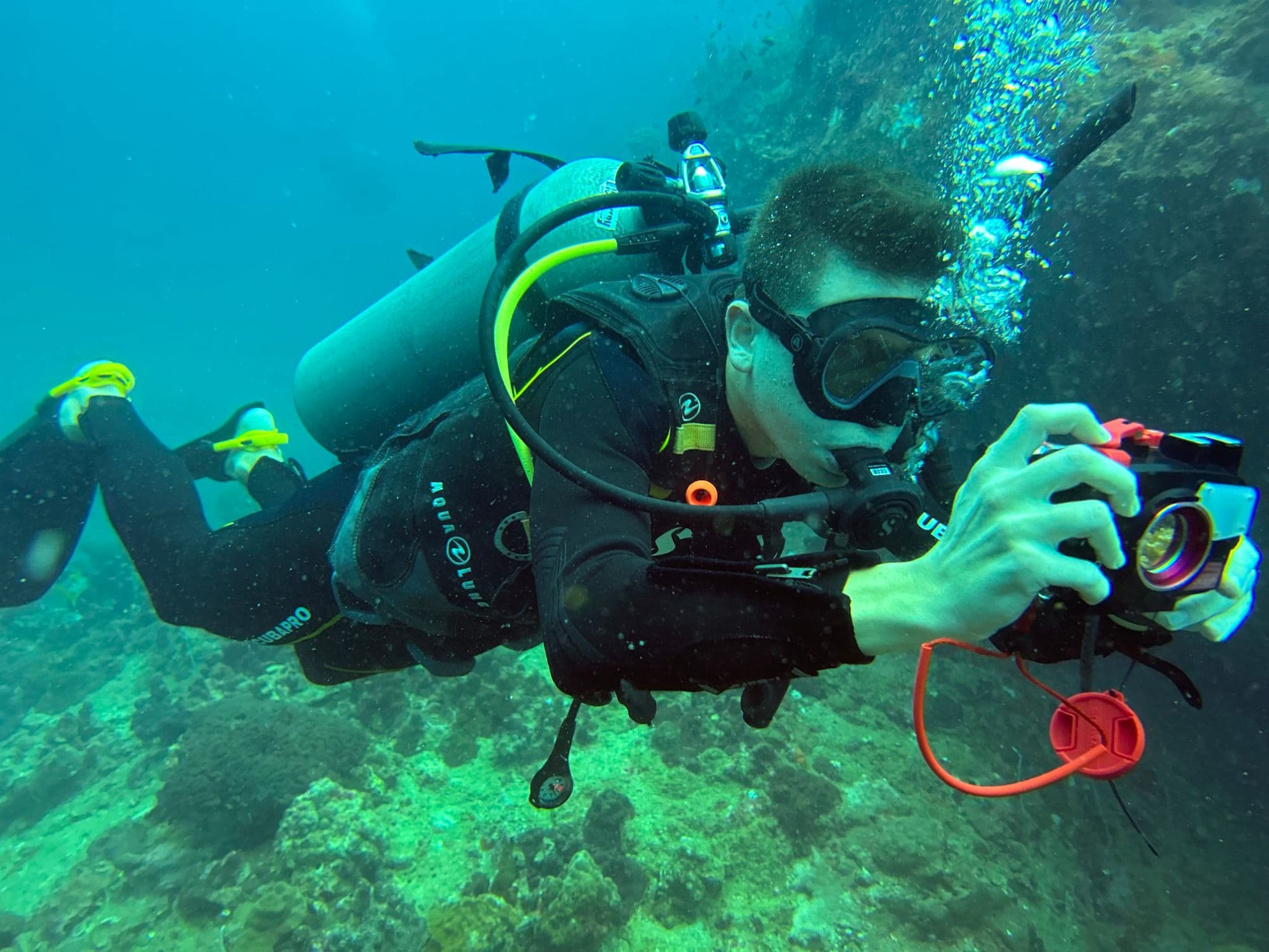 The diver behind Jammin's Depths, underwater with a camera in the Gulf of Thailand